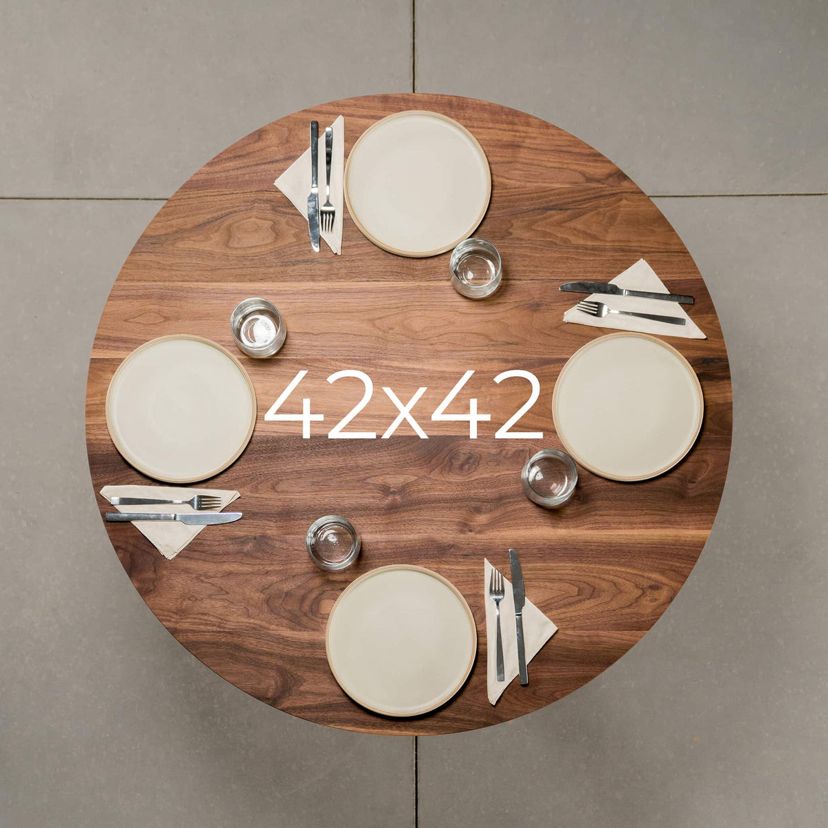 seating for 4 at a round Walnut table 42” wide x 42” long, finished in Pure D 