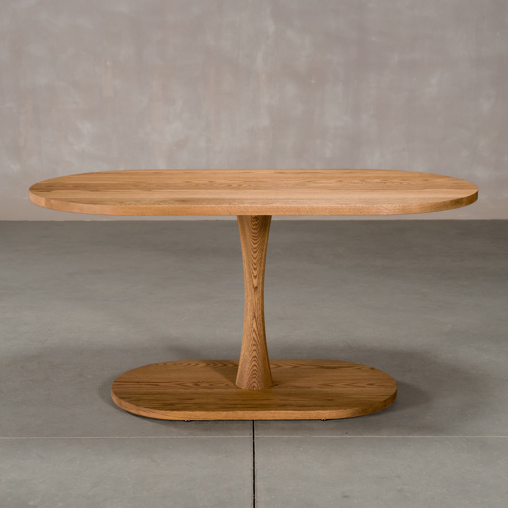 oval Red Oak table 32” wide x 60” long, finished in Castle Brown D on a Jennings pedestal base