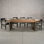 racetrack oval White Oak table 42” wide x 100” long, finished in Dark Roast D on Panuke Trestle base
