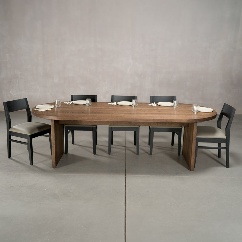 racetrack oval White Oak table 42” wide x 100” long, finished in Dark Roast D on Panuke Trestle base
