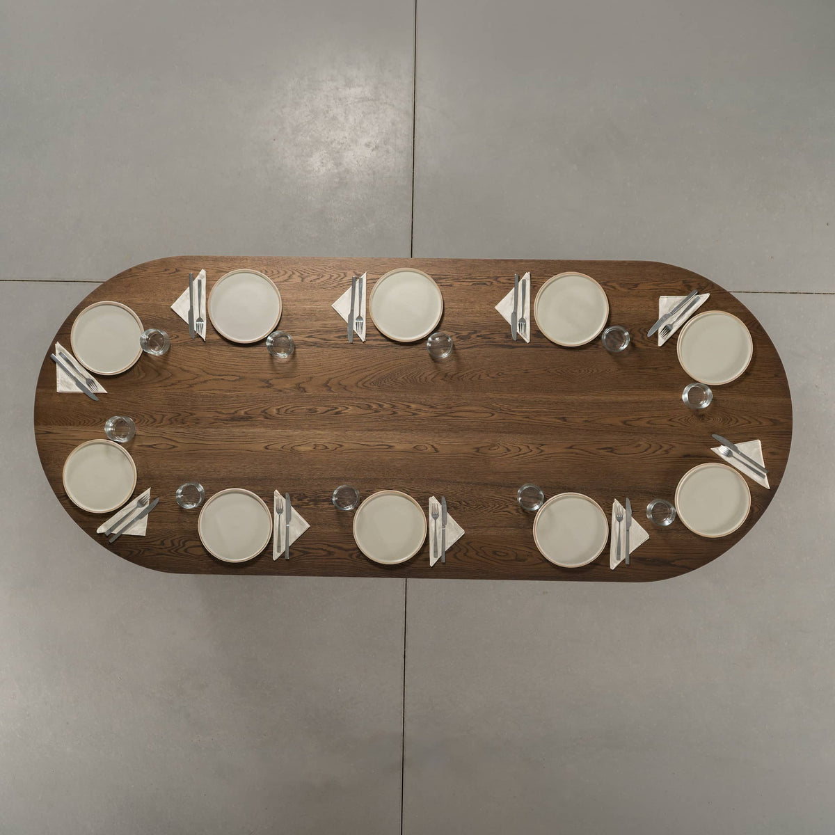 seating for 10 at a racetrack oval White Oak table 42” wide x 100” long, finished in Dark Roast D