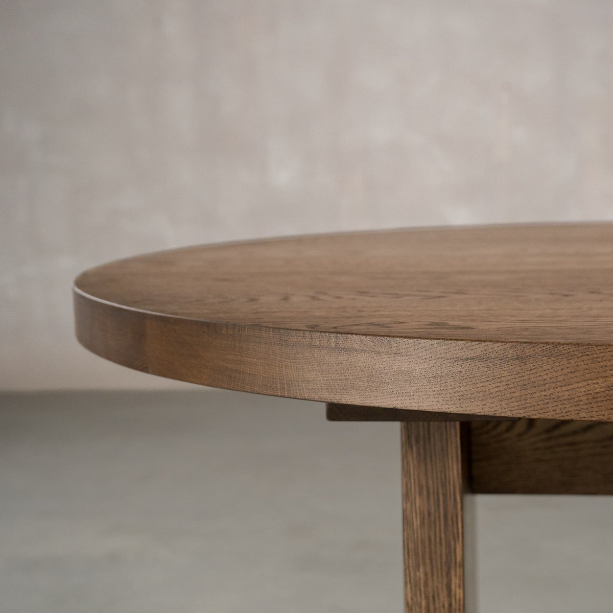 the Seymour edge on a racetrack oval White Oak table finished in Dark Roast D 