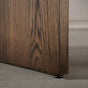 panel leg detail of the Panuke trestle base on a racetrack oval White Oak table finished in Dark Roast D