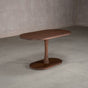oval Walnut table 29” wide x 55” long, finished in Cortado D on a Jennings pedestal base