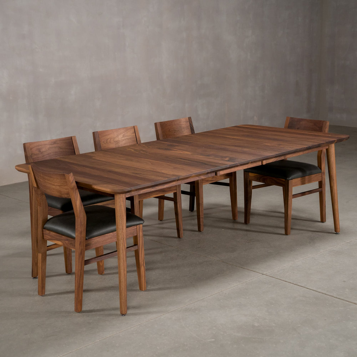extended Walnut table 42” wide x 72” long, with 1-18” leaf finished in Pure D on Milford base; shown with Aubrey chairs