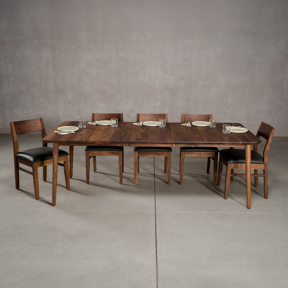 extendaed Walnut table 42” wide x 72” long, with 1-18” leaf finished in Pure D on Milford base; shown with Aubrey chairs 