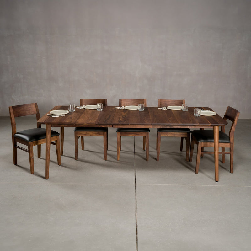 extendaed Walnut table 42” wide x 72” long, with 1-18” leaf finished in Pure D on Milford base; shown with Aubrey chairs 