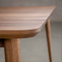 the Milford edge on an extendable Walnut table finished in Pure D on Milford base