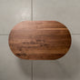 overhead view of an oval Walnut table 30” wide x 48” long, finished in Pure D 