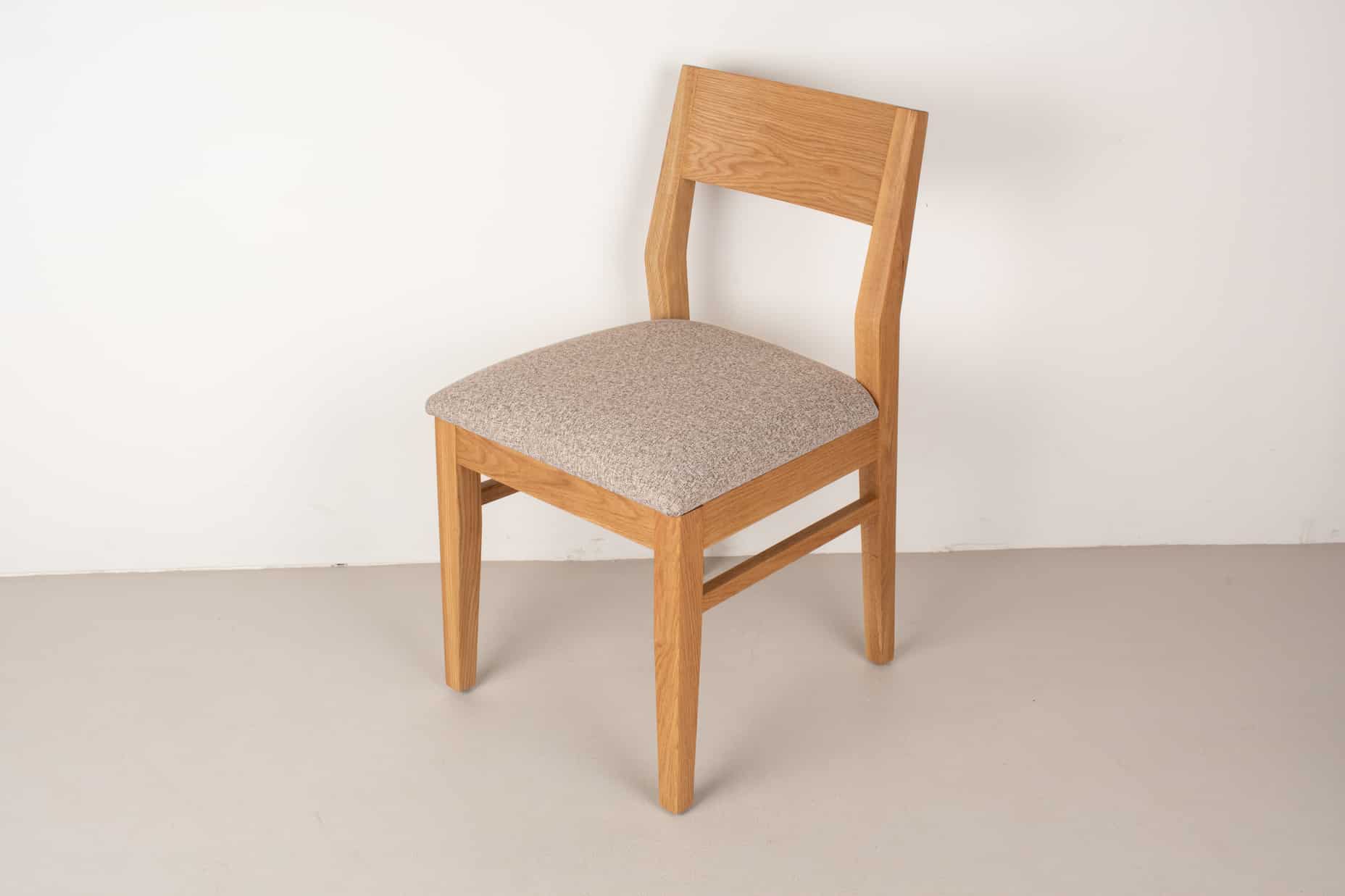 clay fabric seat on natural oak chair