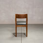 an Aubrey side chair in Walnut with a Thunder Leather seat
