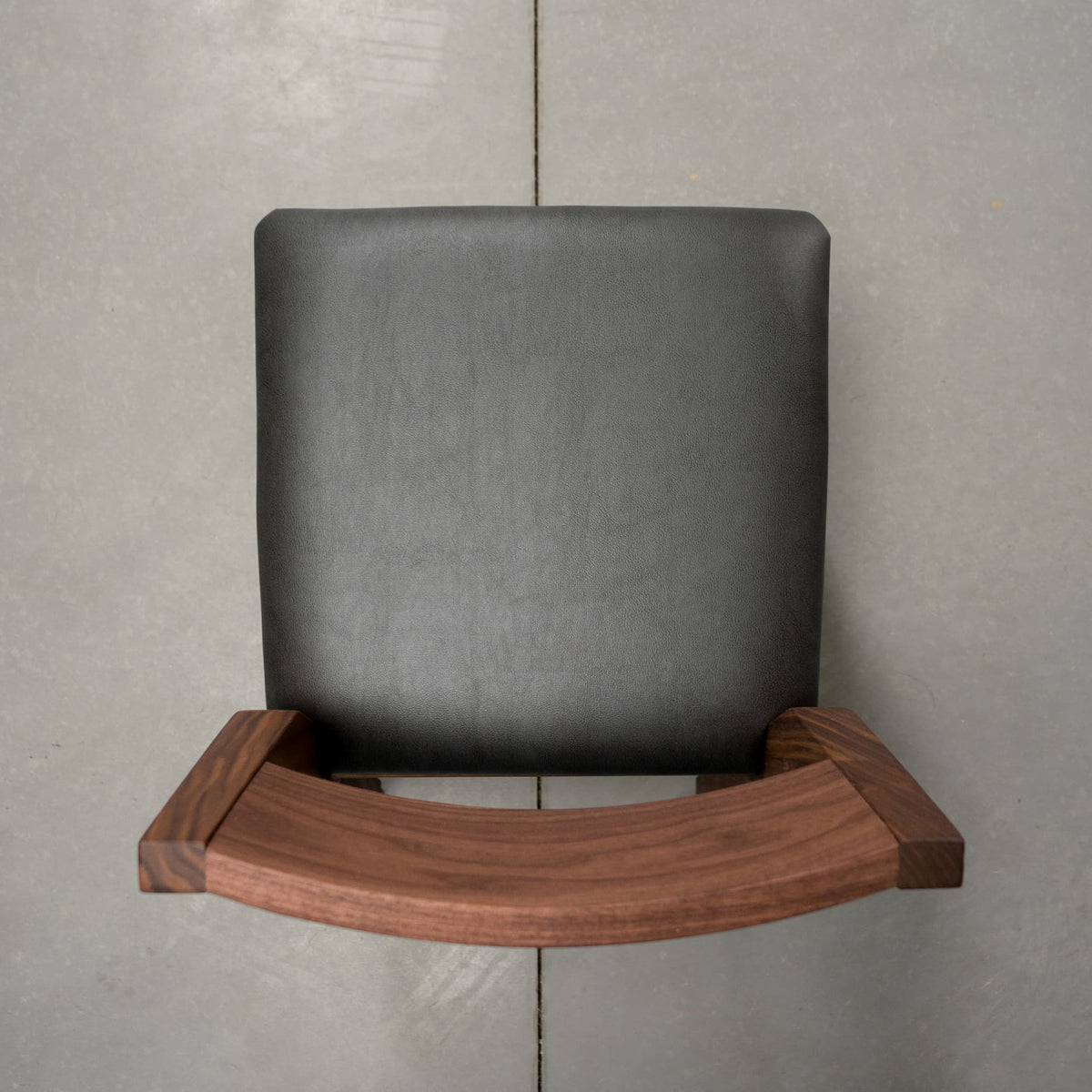 overhead view of an Aubrey side chair in Walnut with a Thunder Leather seat