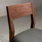 the seat back on an Aubrey side chair in Walnut with a Thunder Leather seat