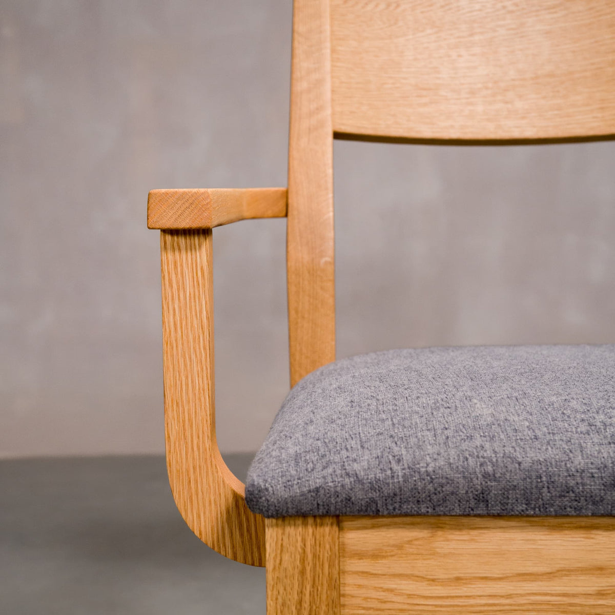 arm detail on a White Oak Aubrey Armchair finished in Pure D with Graphite fabric seat