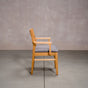 a White Oak Aubrey Armchair finished in Pure D with Graphite fabric seat