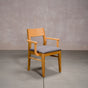 a White Oak Aubrey Armchair finished in Pure D with Graphite fabric seat
