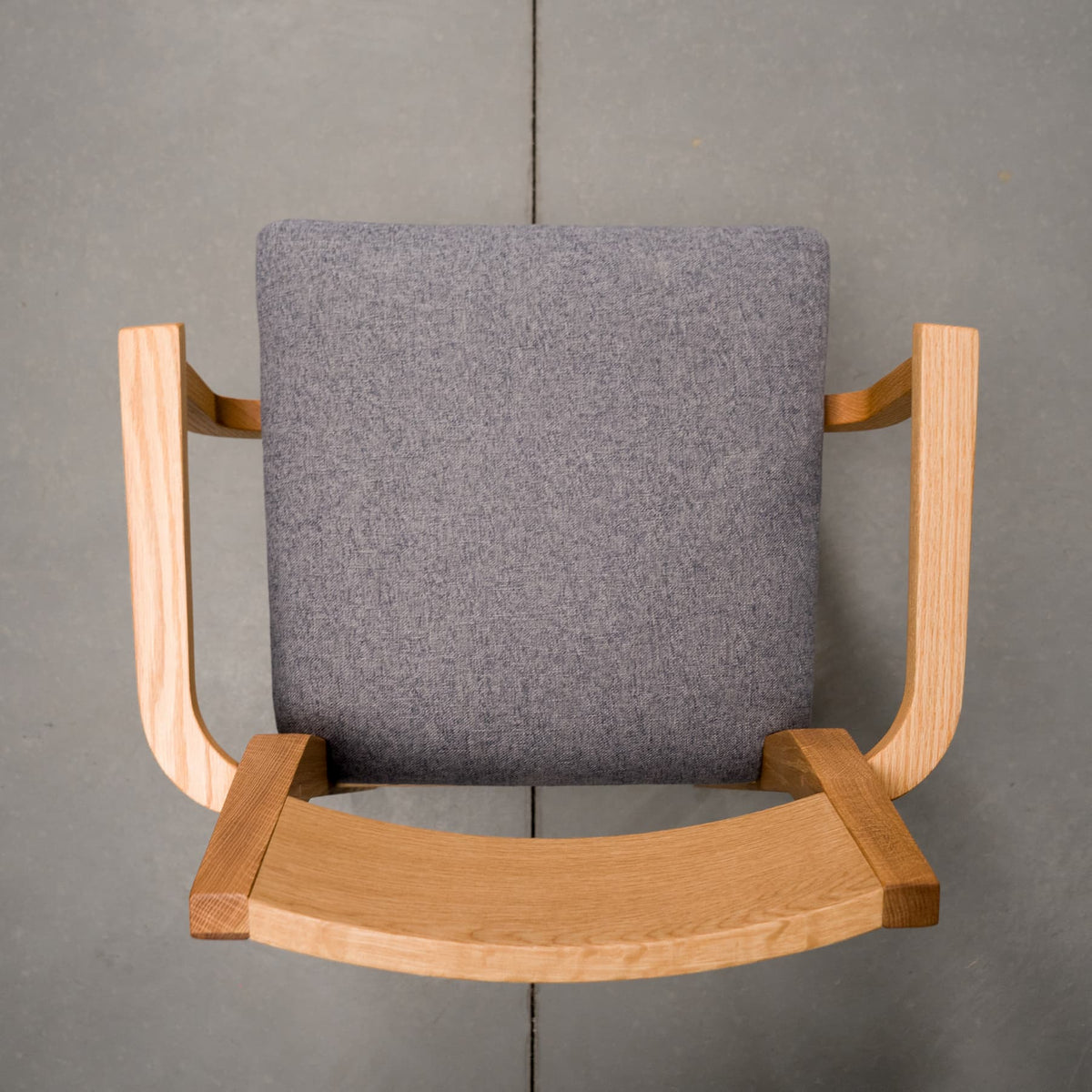 overhead view of a White Oak Aubrey Armchair finished in Pure D with Graphite fabric seat