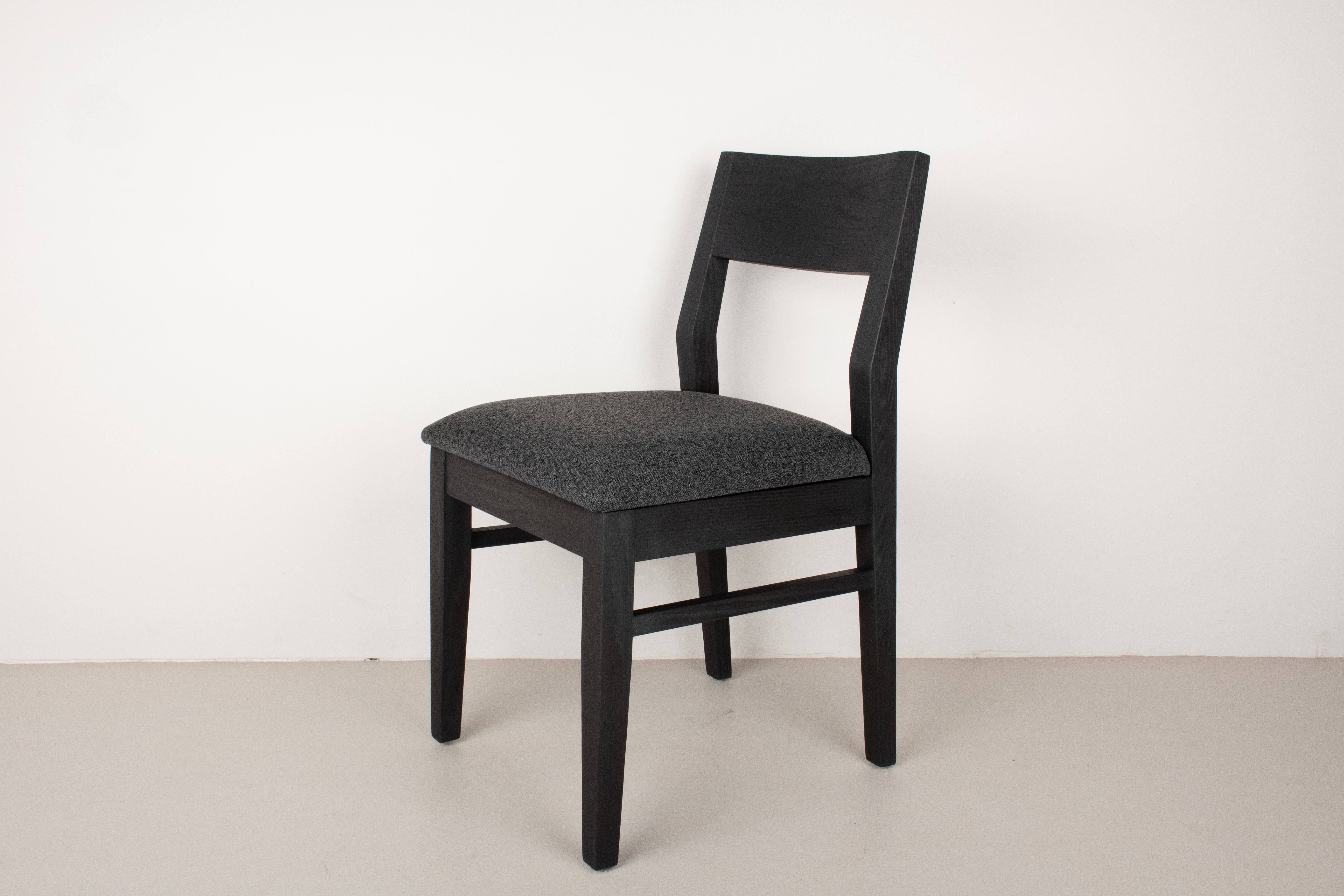 Straight Edge Walnut Table 48x108 plus 8 Black Oak Aubrey Arm Chairs with fabric seats