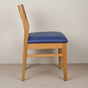 Oak chair finished in Pure D with a Blueberry faux leather seat