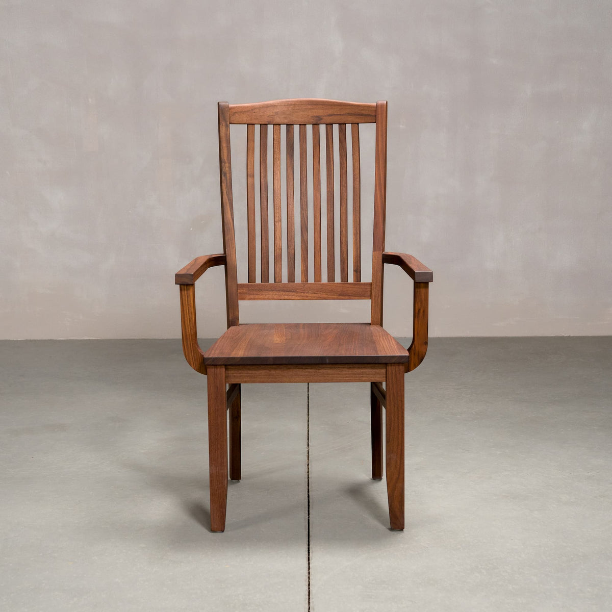 a high back dining chair with arms in Walnut