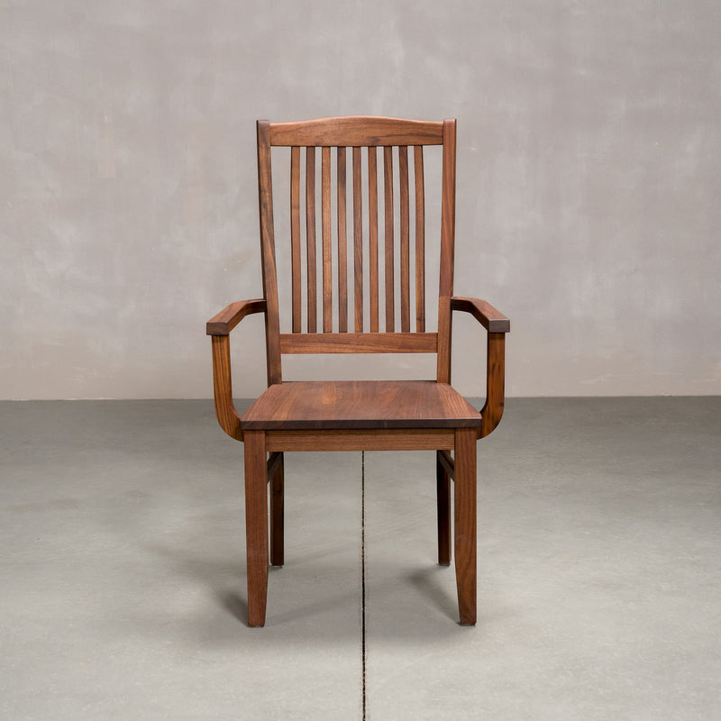 a high back dining chair with arms in Walnut