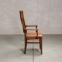 a high back dining chair with arms in Walnut