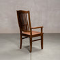 a high back dining chair with arms in Walnut