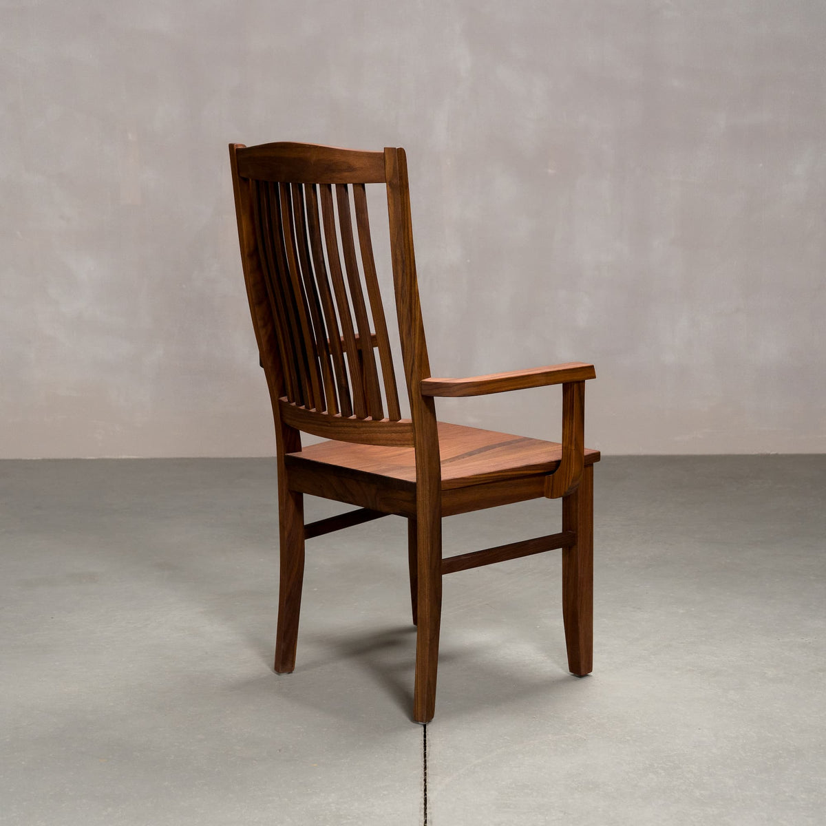 a high back dining chair with arms in Walnut