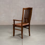 a high back dining chair with arms in Walnut