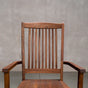 a high back dining chair with arms in Walnut