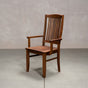 a high back dining chair with arms in Walnut