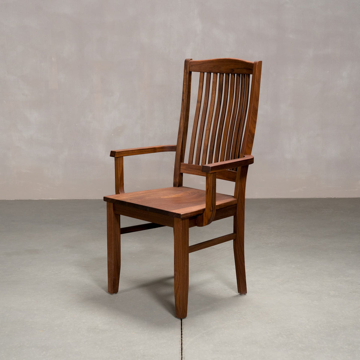 a high back dining chair with arms in Walnut