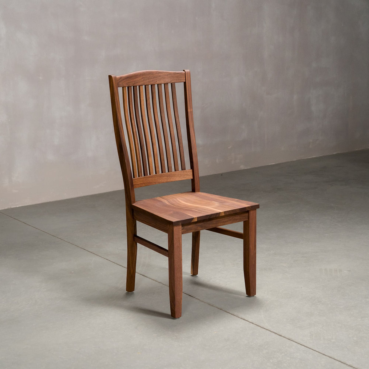 high back Betzner dining chair in Walnut