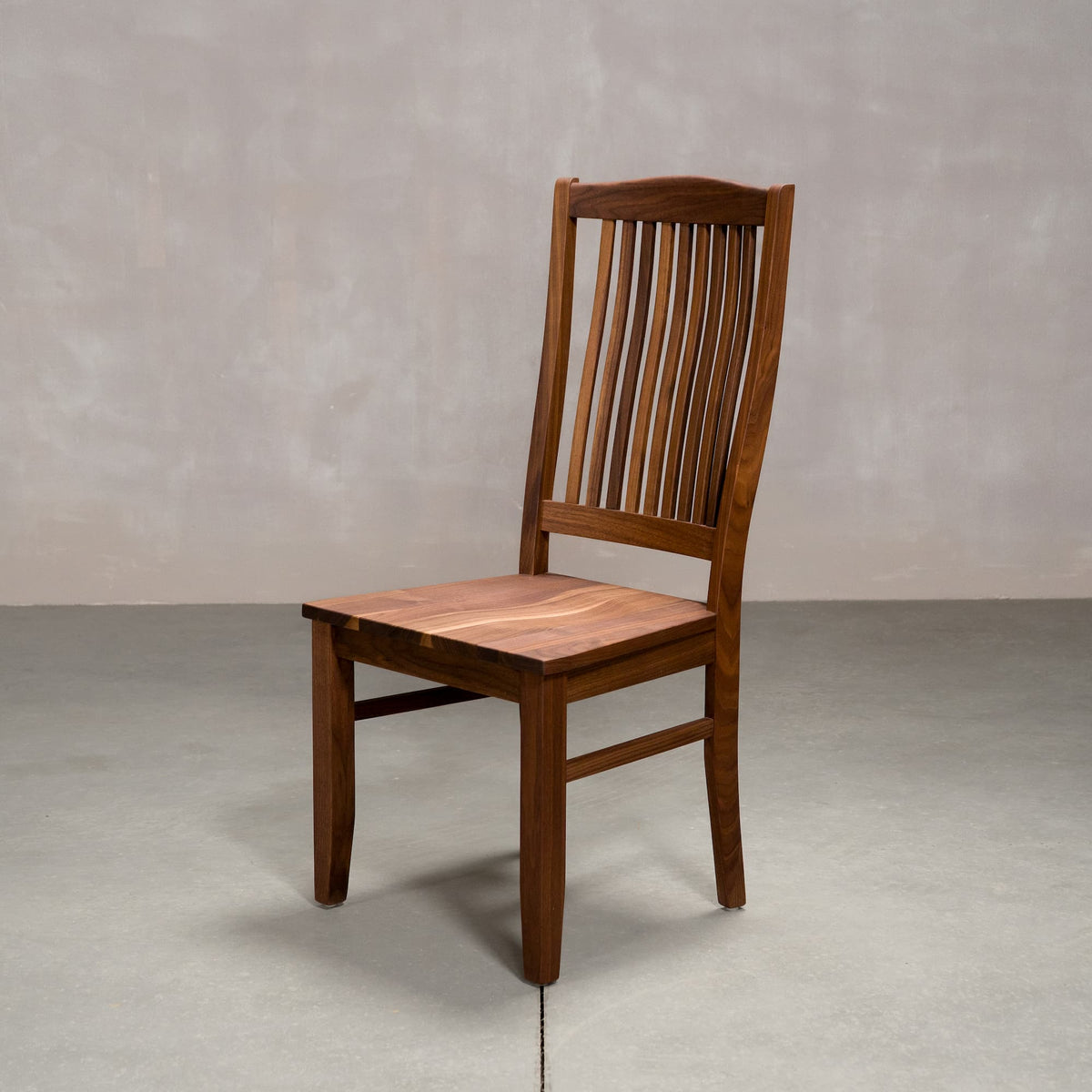 high back Betzner dining chair in Walnut