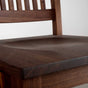 seat detail of a high back walnut dining chair with arms