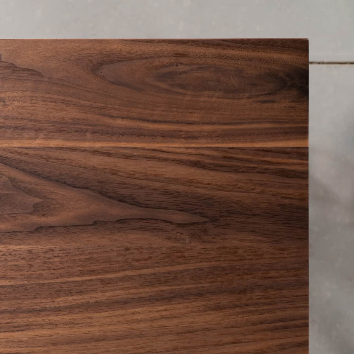 corner detail of a custom walnut ping pong table 