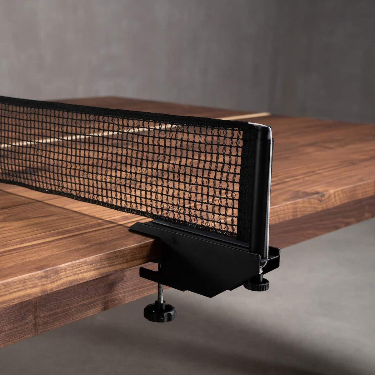 net detail on a custom walnut ping pong table 