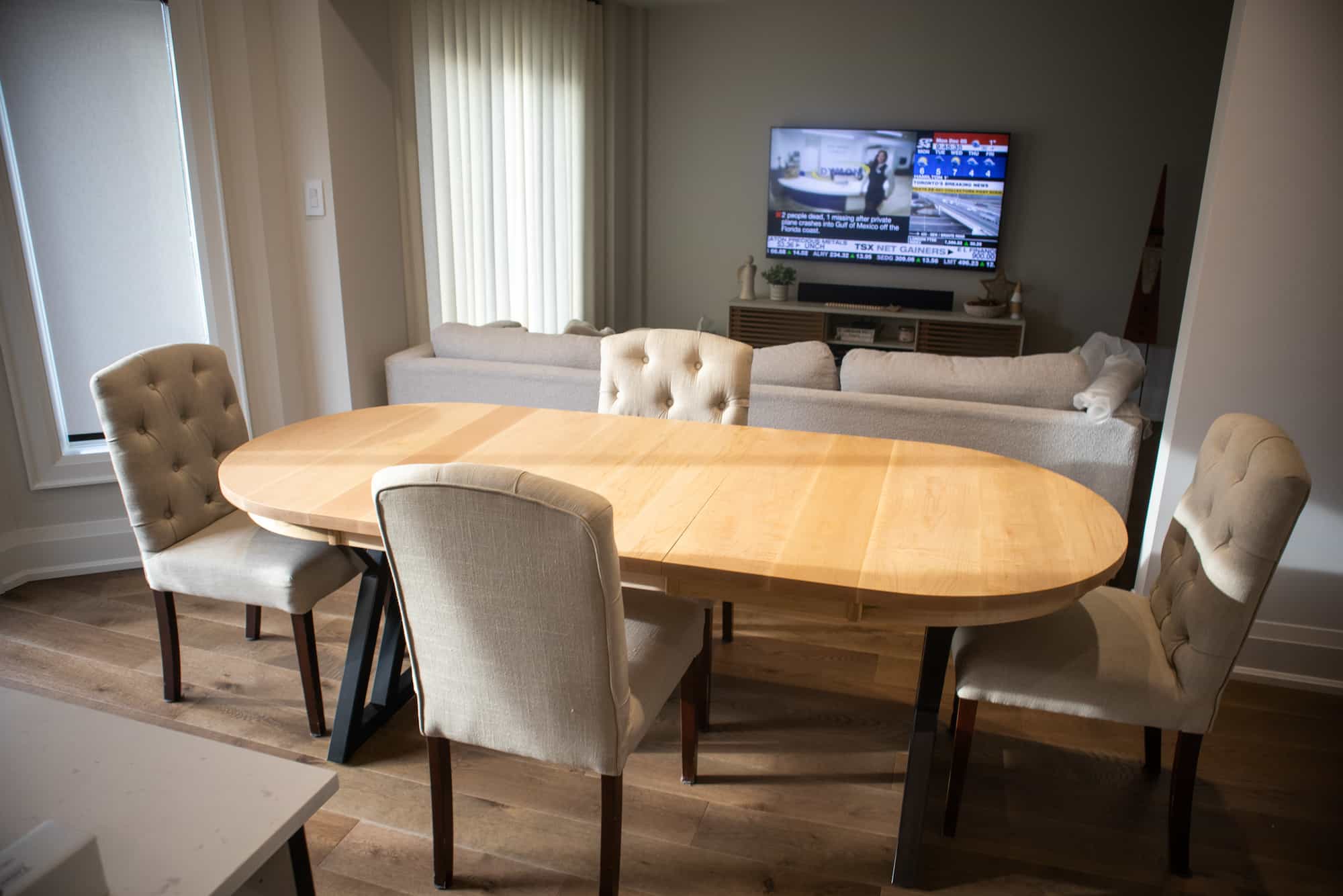 extendable oval dining table in rock maple on black steel legs