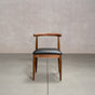 midcentury modern Walnut dining chair with an Onyx Faux Leather seat