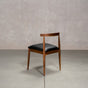 midcentury modern Walnut dining chair with an Onyx Faux Leather seat