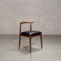midcentury modern Walnut dining chair with an Onyx Faux Leather seat
