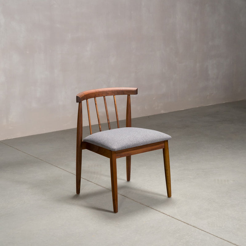 midcentury modern Walnut dining chair with back spindles and Graphite fabric seat
