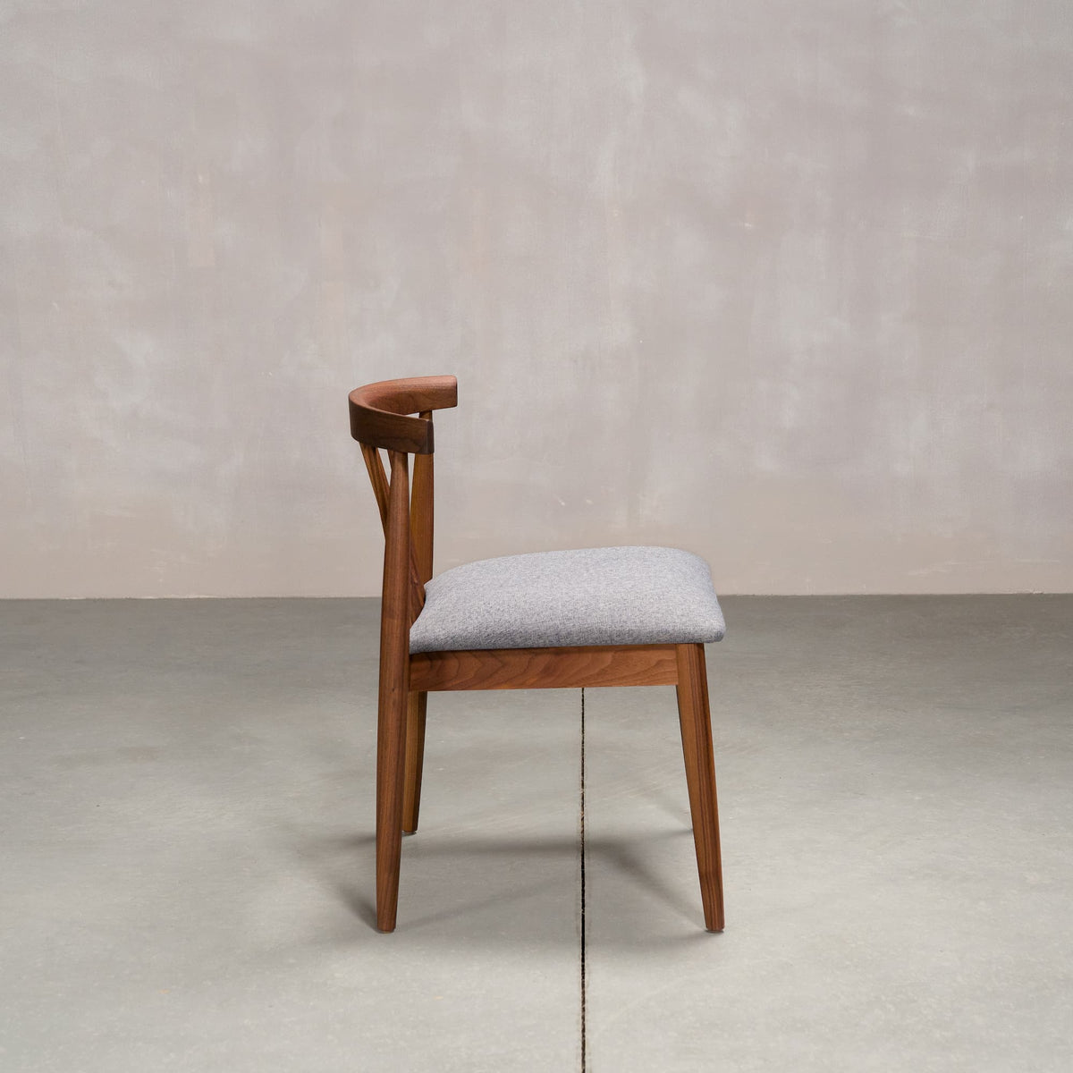 midcentury modern Walnut dining chair with back spindles and Graphite fabric seat
