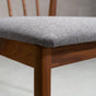 seat detail of a midcentury modern Walnut dining chair with back spindles and Graphite fabric seat
