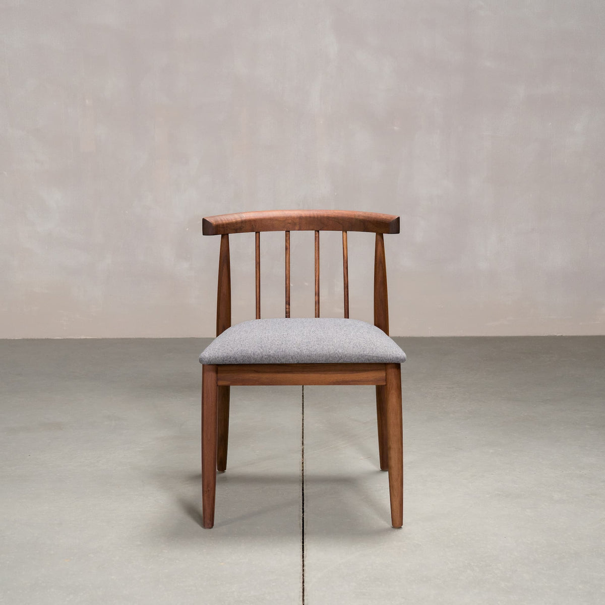 midcentury modern Walnut dining chair with back spindles and Graphite fabric seat