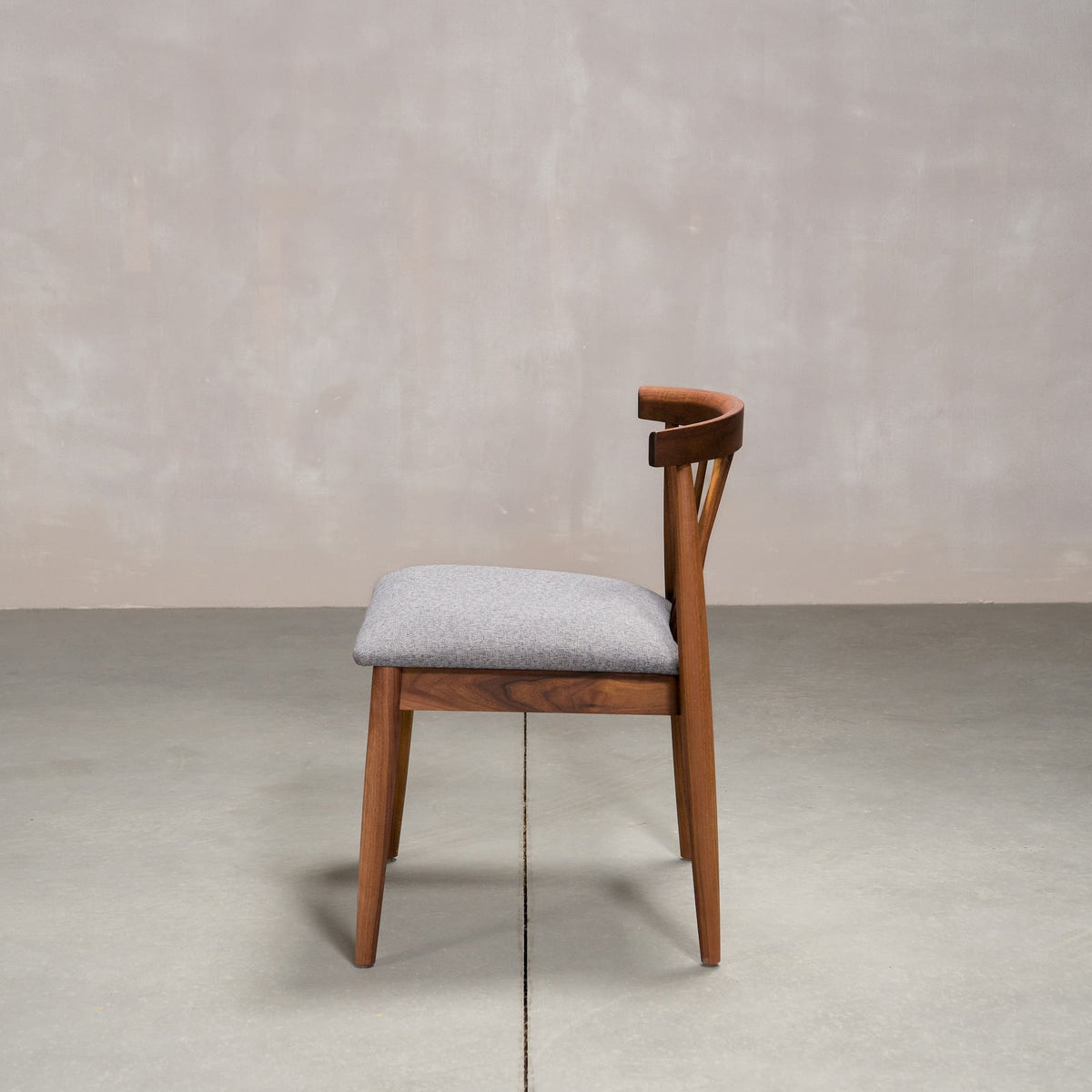 midcentury modern Walnut dining chair with back spindles and Graphite fabric seat