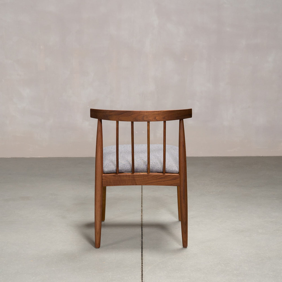 midcentury modern Walnut dining chair with back spindles and Graphite fabric seat