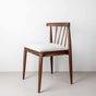 Walnut dining chair with a white leather seat