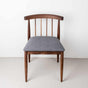 Walnut dining chair with a gray fabric seat