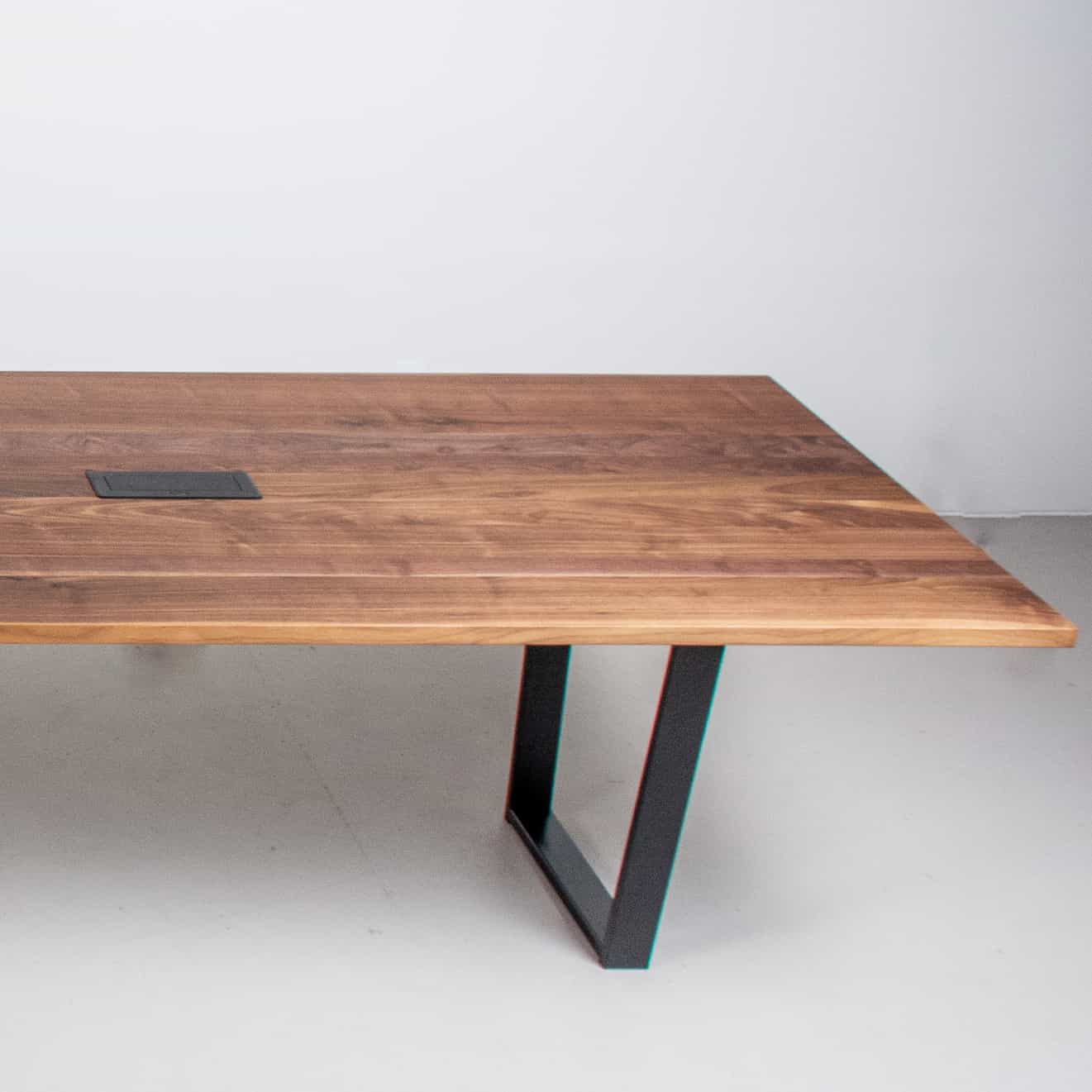 long walnut conference table with grommet